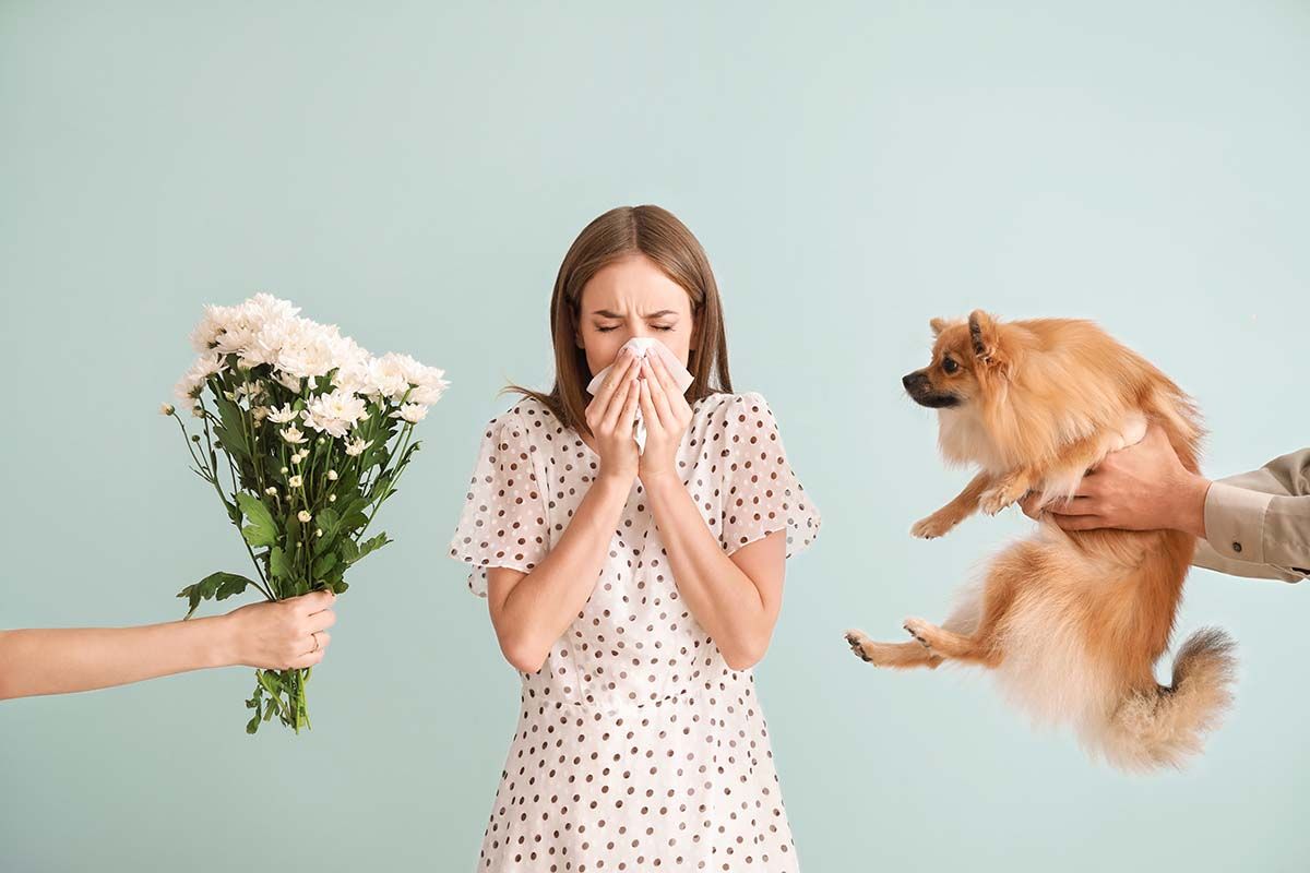 woman sneezing to dog and flower allergies